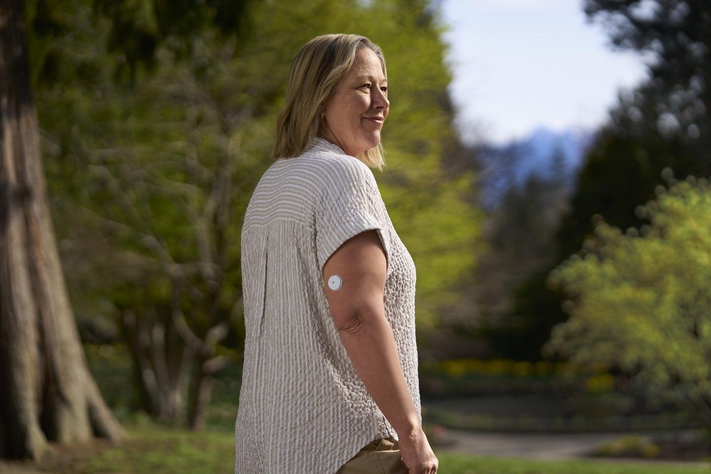 8 Game-Changing Diabetes Insights Today 1 Woman wearing FreeStyle Libre CGM device, symbolizing reduced heart hospitalization risk