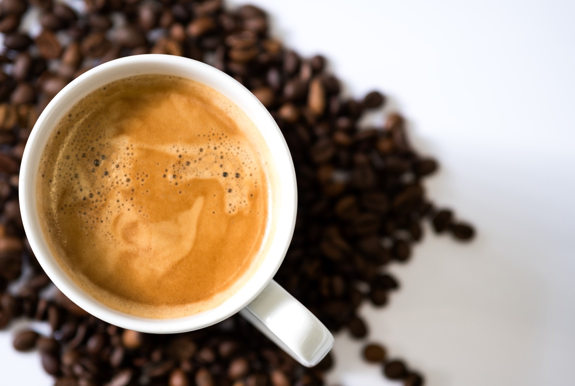 Cup of coffee and beans for diabetes management