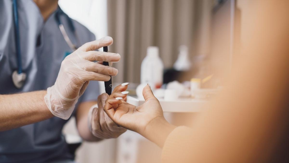 Medical professional conducting diabetes blood test for new treatments