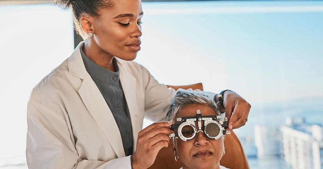 Doctor examining patient's eyes for diabetic macular edema treatment with lamivudine