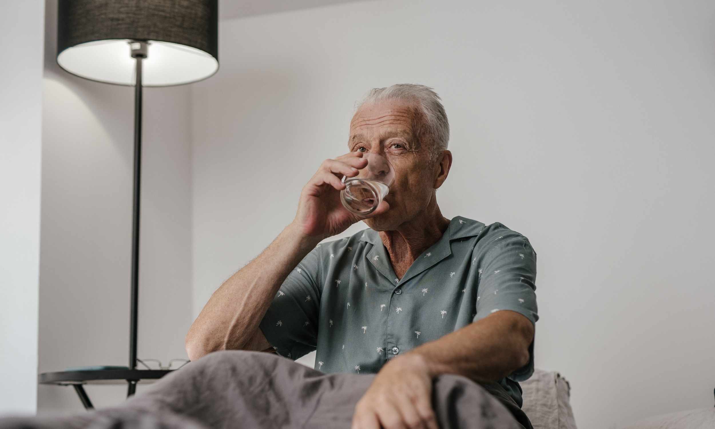 Person drinking water to control blood sugar levels