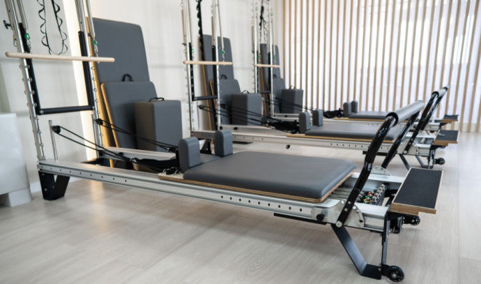 A well-equipped gym room with various exercise machines and equipment, highlighting Alison Hammond's weight loss journey and commitment to fitness