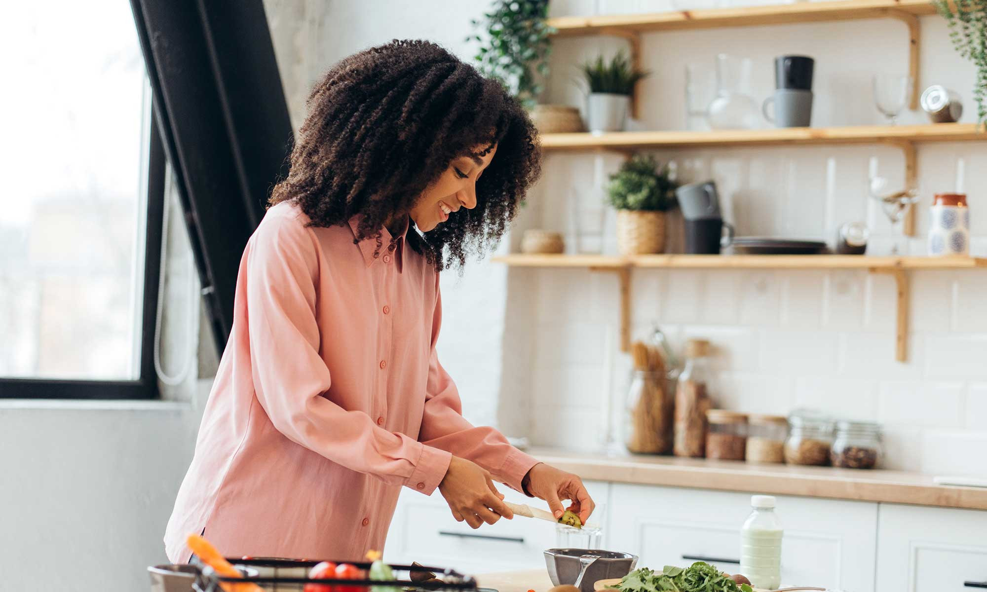 Woman cooking heart-healthy meal with phytosterol foods