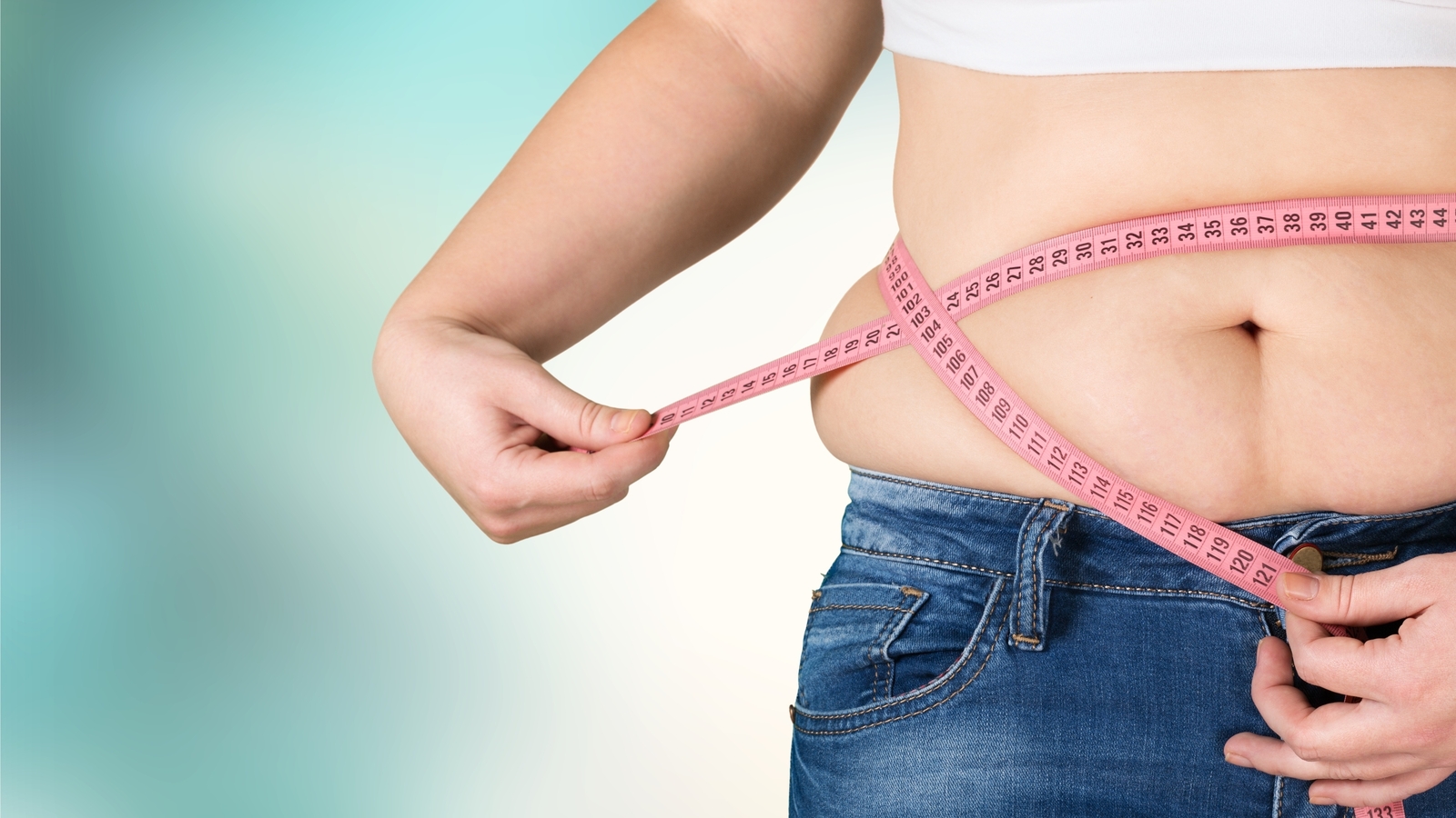 9 Surprising Diabetes Insights: Metformin, Natural Reversal, and Cutting-Edge Therapies 2 Woman measuring waist to reverse type 2 diabetes